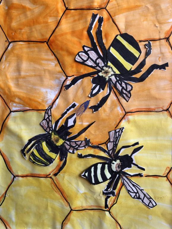 Students created their own honey bee drawings to add to a large honeycomb that covered a wall in the art room.
