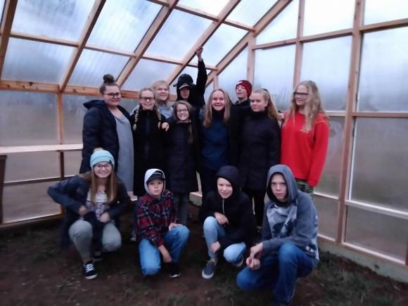 8th grade class in the new greenhouse.
